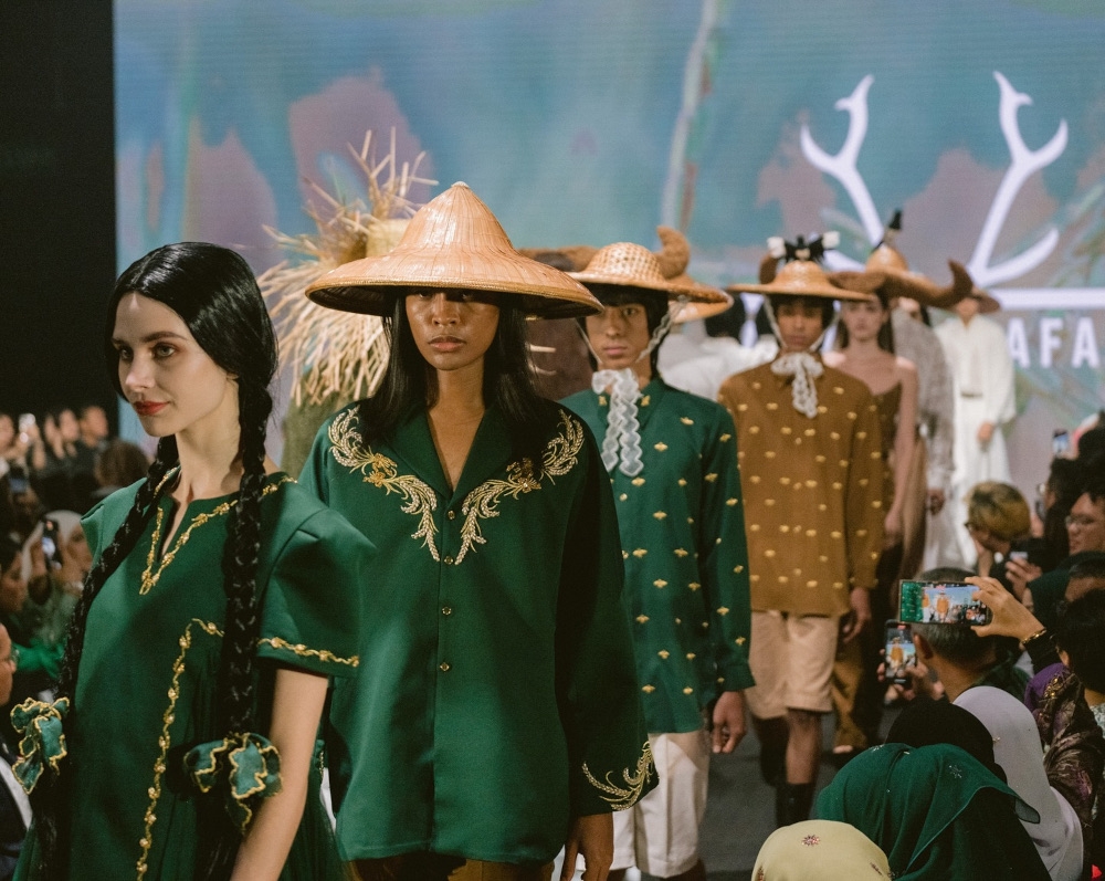 Models parade Zachrin Jaafars’ creations at the brand’s show at Kuala Lumpur Fashion Week (KLFW) in August. — Picture from Facebook/Maison.Zachrinjaafars