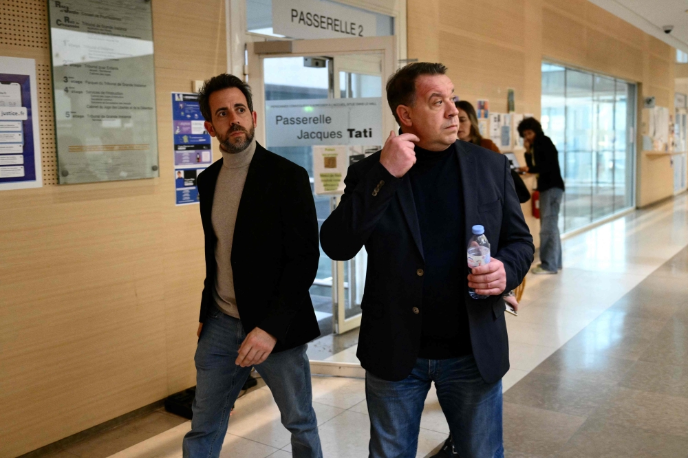 Gisele Pelicot’s sons David (right) and Florian leave the courthouse after a hearing in the trial of their father Dominique Pelicot accused of drugging their mother for nearly ten years and inviting strangers to rape her at their home in Mazan, a small town in the south of France, in Avignon, on November 18, 2024. — Reuters pic  