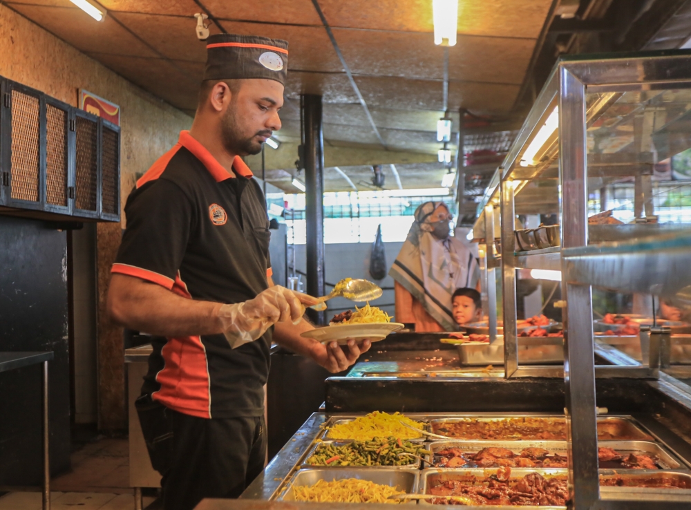 A file photograph shows a worker at an Indian Muslim restaurant in Ipoh, Perak, on August 15, 2022. — Picture by Farhan Najib
