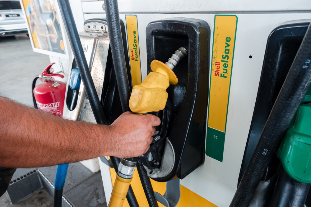 The government has agreed in principle to allow petrol station operators to employ foreign workers for cleaning and maintenance work in cafés and convenience shops at petrol stations. — Picture by Raymond Manuel