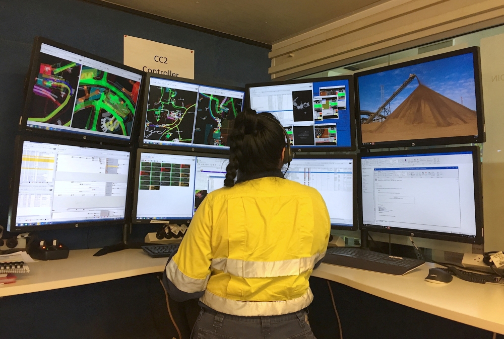 A worker for Australia’s Fortescue Metals Group (FMG) watches screens that monitor autonomous vehicles at FMG’s Chichester Hub iron ore operations, which includes the Christmas Creek iron ore mine, in the Pilbara region, located south-east of the coastal town of Port Hedland in Western Australia, November 29, 2018. — Reuters pic 
