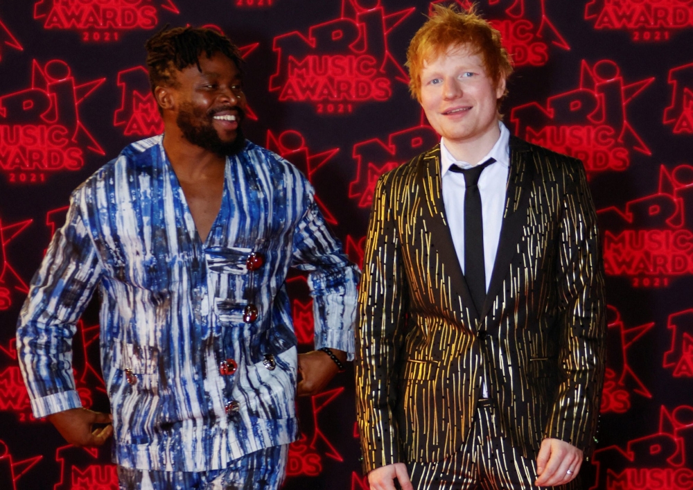 Ed Sheeran and Fuse ODG pose as they arrive to attend the NRJ Music Awards ceremony at the Festival Palace in Cannes, France, in this file picture dated November 20, 2021. The British-Ghanaian musician urged other artists to follow in the steps of Sheeran and speak up about the 1984 hit ‘Do They Know It’s Christmas’, which he says perpetuates negative stereotypes of the African continent. — Reuters pic 