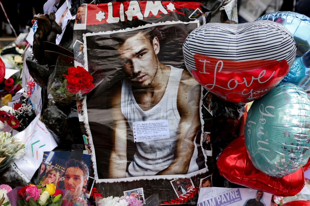 Tributes are placed at a memorial for former One Direction singer Liam Payne, who was found dead after he fell from a third-floor hotel room balcony in Buenos Aires, in Hyde Park, London, Britain, October 20, 2024. — Reuters pic 