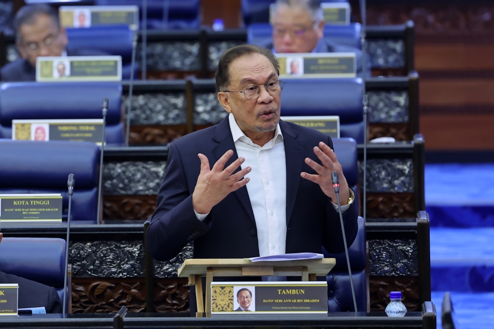 A file photograph shows Prime Minister Datuk Seri Anwar Ibrahim speaking in Parliament, on Oct 29, 2024. — Bernama pic