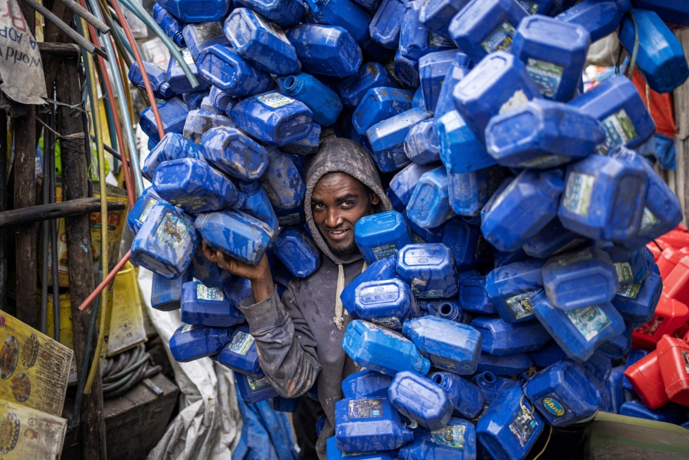 Ezedin Muste, 23 - an informal waste collector known in Amharic as 'korale' - moves a huge pile of plastic soap containers at the historical Merkato district of Addis Ababa on October 1, 2024. Plastic pollution litters our seas, our air and even our bodies, but negotiators face an uphill battle next week to agree the world's first treaty aimed at ending the problem. Countries will have a week in South Korea's Busan from November 25, to round off two years of negotiations. — AFP pic