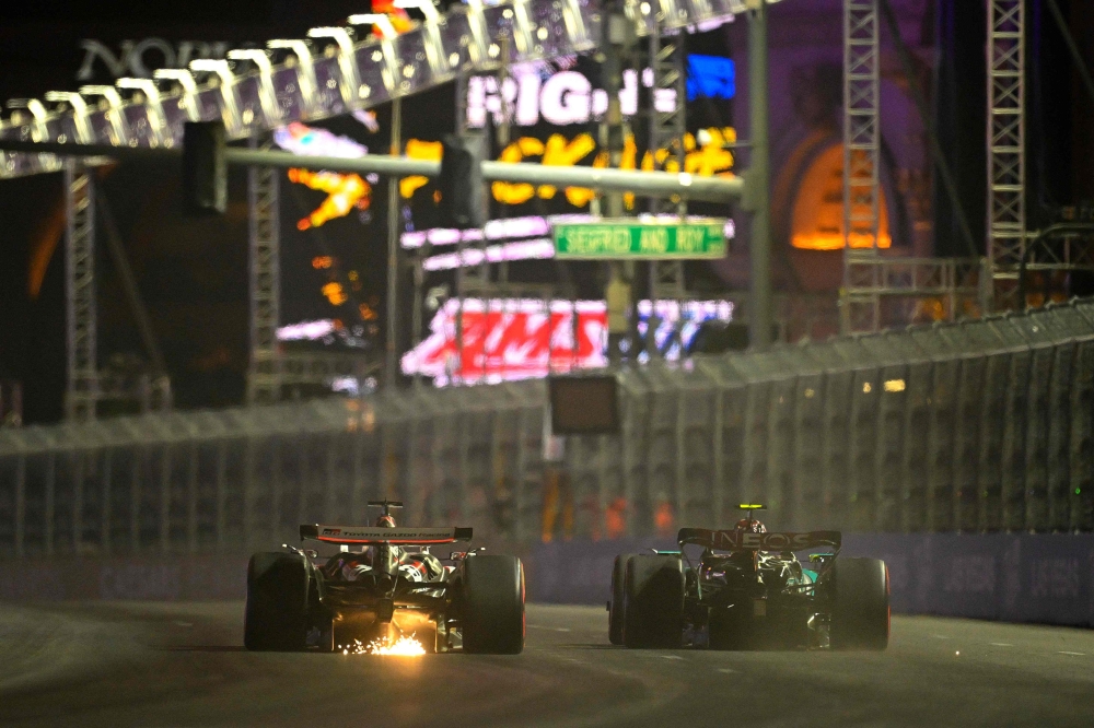 Lewis Hamilton driving the (44) Mercedes AMG Petronas F1 Team W15 leads Kevin Magnussen of Denmark driving the (20) Haas F1 VF-24 Ferrari on track during practice ahead of the F1 Grand Prix of Las Vegas. — AFP