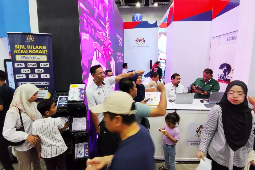 Education Ministry is offering a reprint of education certificates at the Madani govt's two-year anniversary. — Picture by Muhammad Yusry