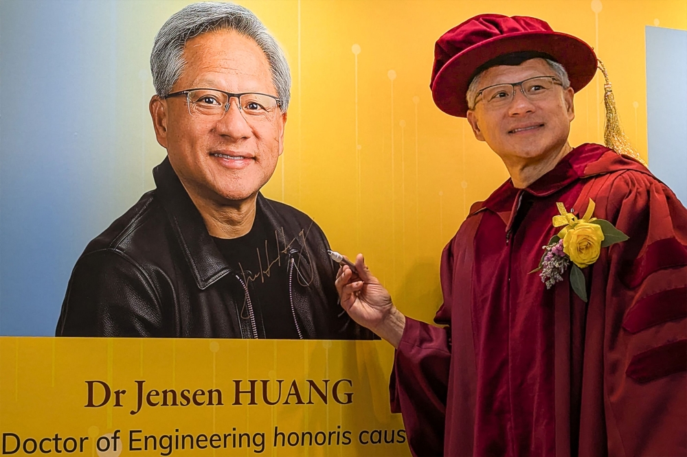 Nvidia CEO Jensen Huang poses for a photo after receiving an honorary doctorate in engineering from the Hong Kong University of Science and Technology, in Hong Kong on November 23, 2024. — AFP pic