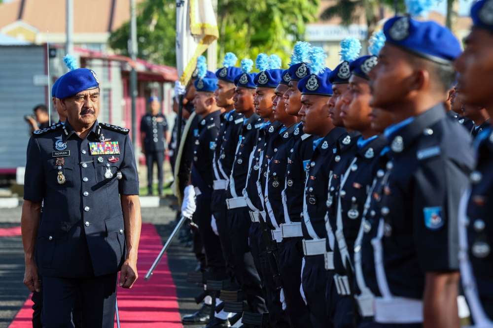 nspector-General of Police Tan Sri Razarudin Husain (left) inspects the Honour Guard during the 77th Marine Police Force Anniversary celebration at the Marine Police Force Headquarters in Lahad Datu. Nov 23, 2024. — Bernama pic