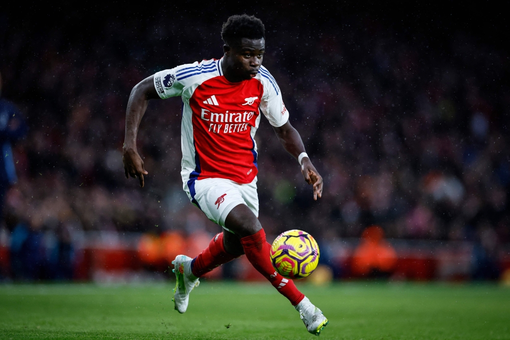 Arsenal's English midfielder #07 Bukayo Saka controls the ball during the English Premier League football match between Arsenal and Nottingham Forest at the Emirates Stadium in London on November 23, 2024. — AFP pic