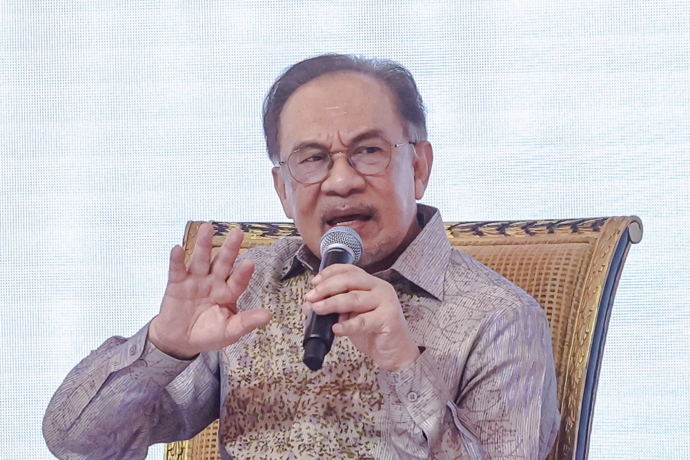 Prime Minister Datuk Seri Anwar Ibrahim lambasted critics of his administration’s efforts to attract investments, describing their accusations as baseless. — Picture by Firdaus Latif