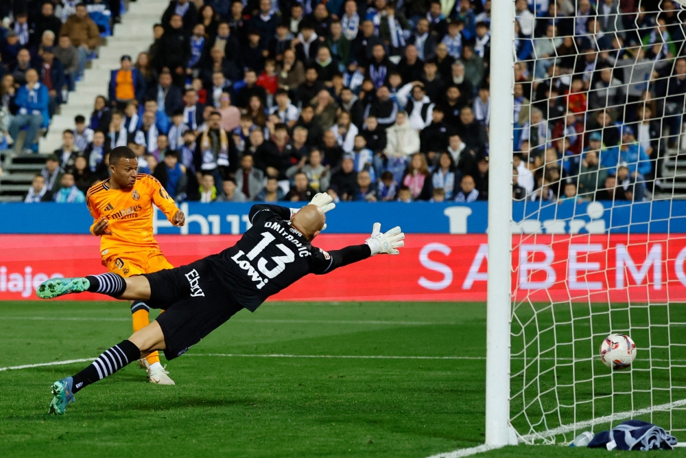 Real Madrid’s French forward #09 Kylian Mbappe scores the opening goal during the Spanish league football match between Club Deportivo Leganes SAD and Real Madrid CF at the Estadio Municipal Butarque in Leganes on November 24, 2024. –– AFP pic