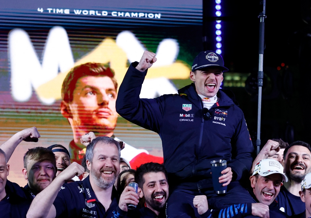 Red Bull’s Max Verstappen celebrates with his team after winning the 2024 F1 world championship title at the Las Vegas Strip Circuit, Las Vegas, Nevada, November 24, 2024. –– Reuters pic 