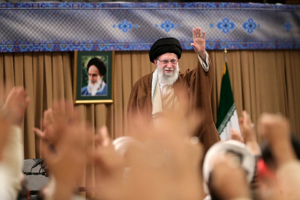 Iran’s Supreme Leader Ayatollah Ali Khamenei waves during a meeting with members of Iran’s Basij militia in Tehran, Iran, November 25, 2024. — Office of the Iranian Supreme Leader/WANA (West Asia News Agency) handout pic via Reuters 