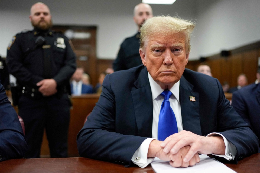 Former US President and Republican presidential candidate Donald Trump attends his criminal trial at Manhattan Criminal Court in New York City May 30, 2024. — Seth Wenig/Pool/AFP pic 