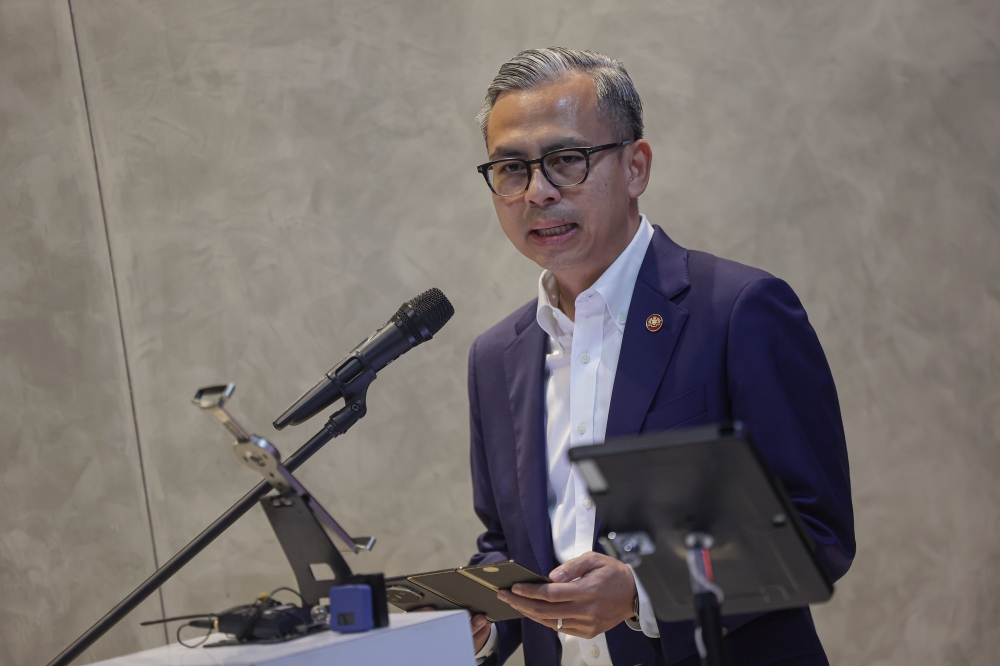 Communications Minister Fahmi Fadzil delivers a speech at the launch ceremony of the MYTV Mana-Mana App for the Proton X Series in Kuala Lumpur, on Nov 26, 2024. — Bernama pic