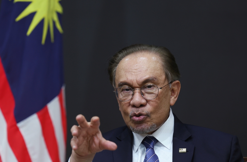 Prime Minister Datuk Seri Anwar Ibrahim speaks at a press conference in Seoul, South Korea, on Nov 26, 2024. — Bernama pic