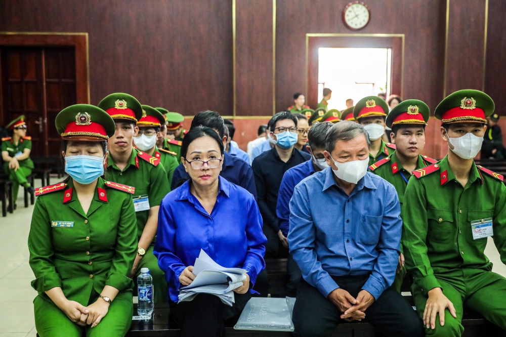 This picture taken on November 25, 2024 shows Vietnamese property tycoon Truong My Lan (second from left) at a court in Ho Chi Minh City. — AFP pic