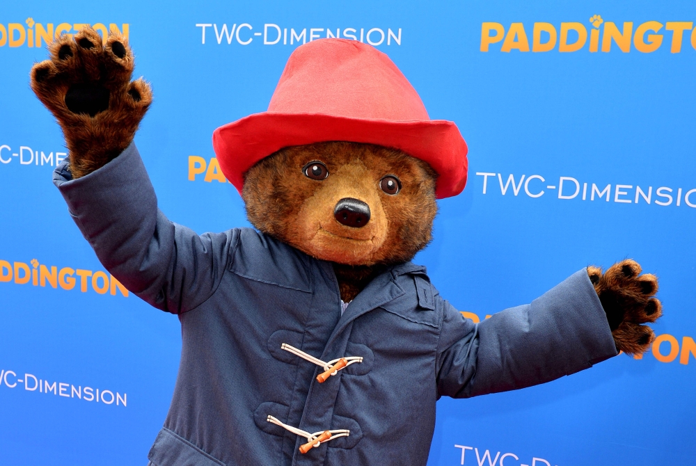 Paddington the bear attends the premiere of ‘Paddington’ held at the TCL Chinese Theatre in Hollywood, California January 10, 2015. Red felt hat, blue duffle coat and eternal smile: a wall of Paddington soft toys awaits visitors in London’s train stations and airports, near souvenirs of London buses or the Royal Guard, which the character has joined in the tourist imagination of the United Kingdom. — AFP pic