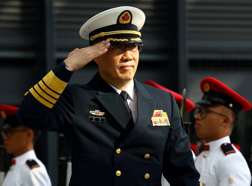 China’s Defence Minister Dong Jun inspects honour guards as part of the third Singapore-China Defence Minister's Dialogue at the Ministry of Defence in Singapore May 30, 2024. — Reuters pic