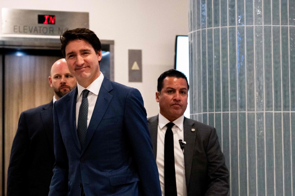 anadian Prime Minister Justin Trudeau exits the Delta Hotels by Marriott West Palm Beach ahead of a meeting with U.S. President-elect Donald Trump on November 29, 2024 in Palm Beach, Florida. — AFP pic