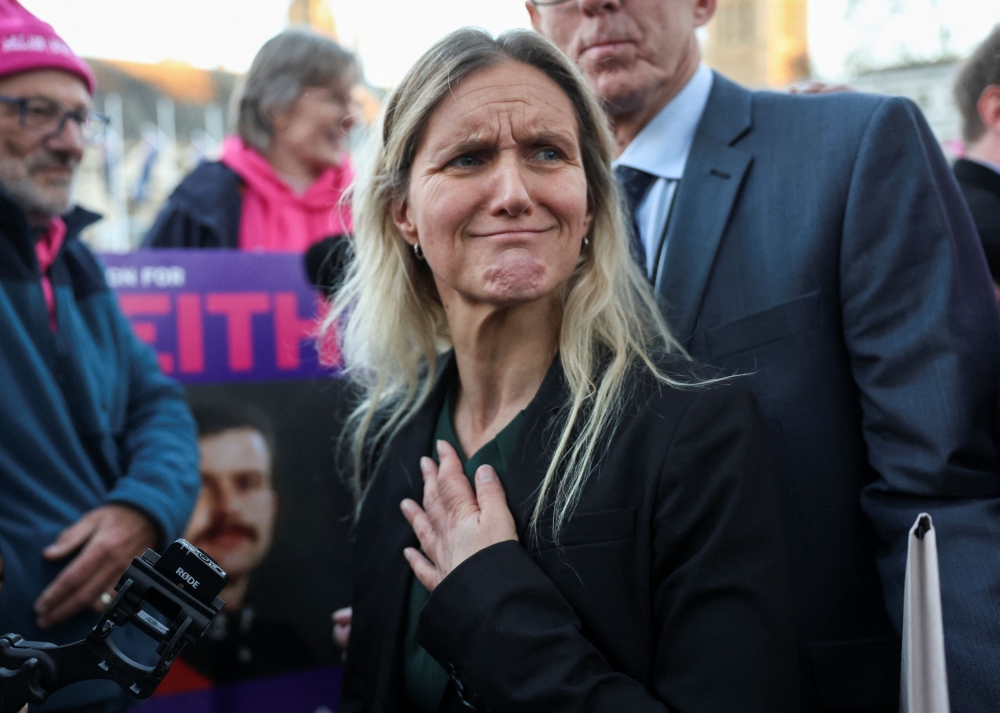 Kim Leadbeater, MP for Spen Valley, reacts during a demonstration in support of assisted dying outside the British parliament after lawmakers voted in favour of the assisted dying law, in London yesterday. — Reuters pic