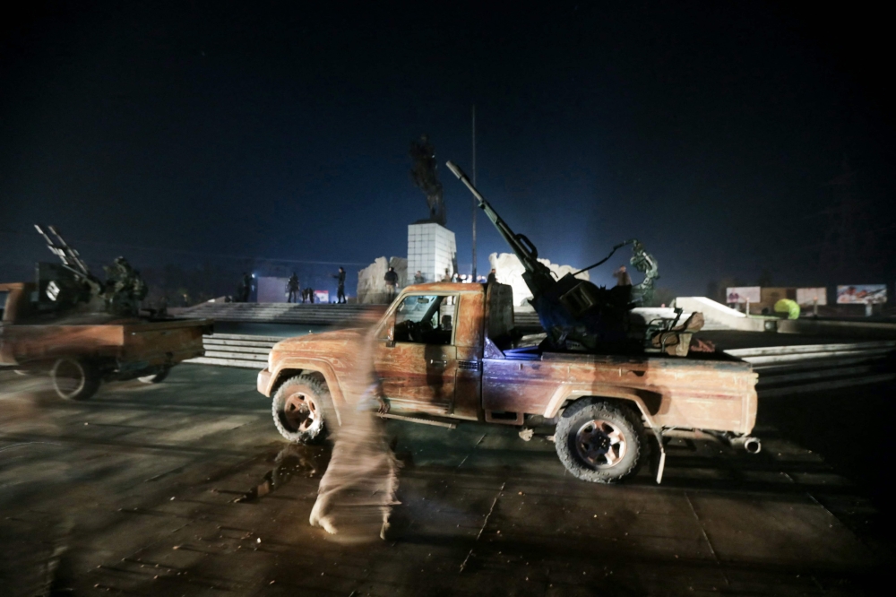 This photo shows Syrian jihadists in the streets of the northern Syrian city of Aleppo on November 30, 2024. Jihadists and their Turkish-backed allies reached Syria's second city of Aleppo on November 30, as they pressed a lightning offensive against forces of the Iranian- and Russian-backed government. — AFP pic