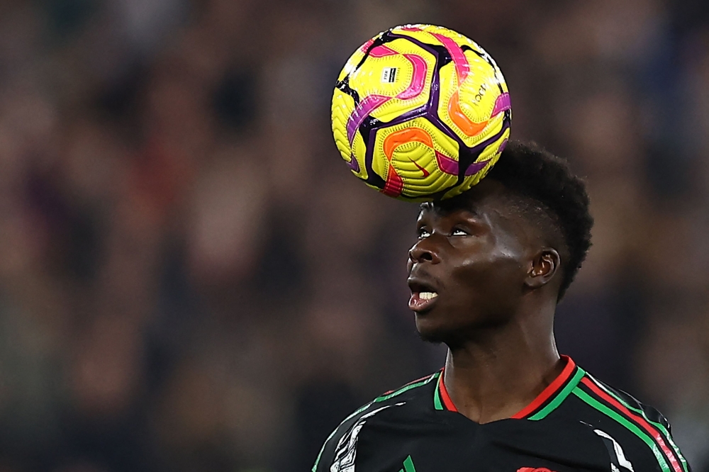 Arsenal’s English midfielder #07 Bukayo Saka controls the ball during the English Premier League football match between West Ham United and Arsenal at the London Stadium, in London on November 30, 2024. — AFP pic