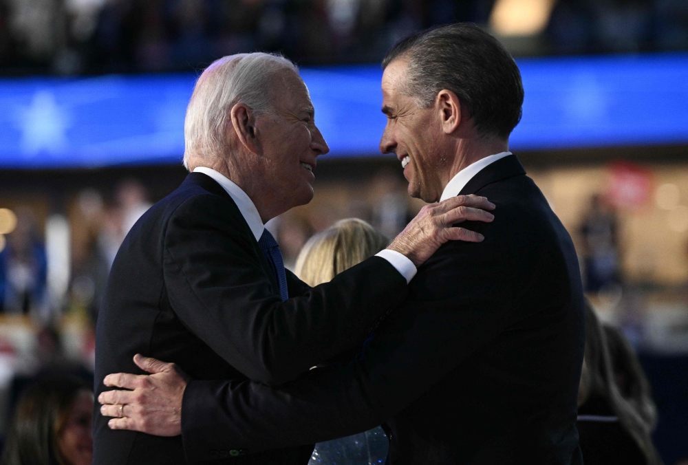 US President Joe Biden is seen with his son Hunter Biden in this August 19,2024 picture. — AFP pic