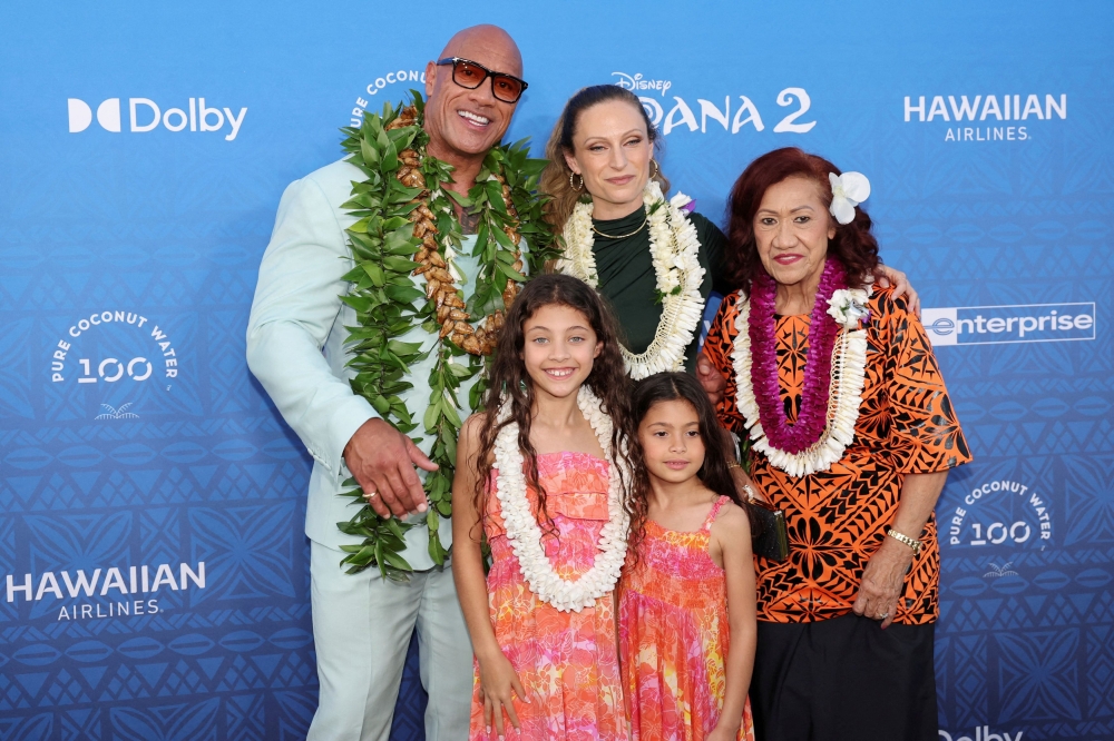 Dwyane ‘The Rock’ Johnson, Jasmine Johnson, Lauren Hashian, Tiana Johnson and Ata Johnson arrive at the premiere of Disney Animation’s film ‘Moana 2’ in Kapolei, Hawaii November 21, 2024. — AFP pic
