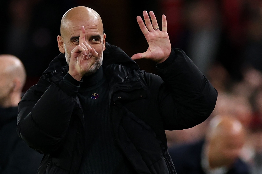 Manchester City's Spanish manager Pep Guardiola, though, could not resist hitting back by showing six fingers, one for each of his title triumphs. — AFP pic