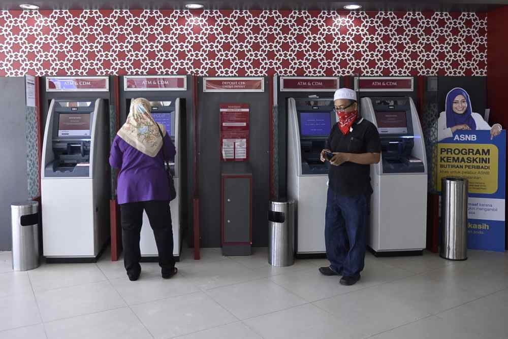 The National Union of Bank Employees (Nube) said the RM1.00 fee, charged for cash withdrawals from automated teller machines (ATMs) outside a customer’s banking network, was waived in April 2020 during the Covid-19 pandemic but reinstated in February 2022. — Picture by Miera Zulyana