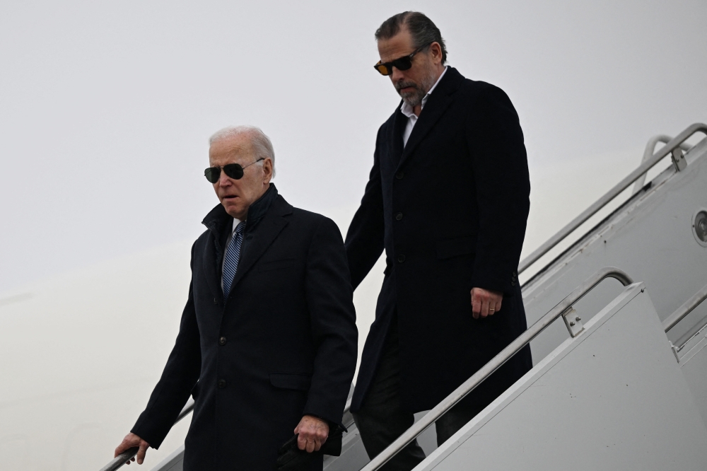 US President Joe Biden, with son Hunter Biden, arrives at Hancock Field Air National Guard Base in Syracuse, New York, on February 4, 2023. — AFP pic