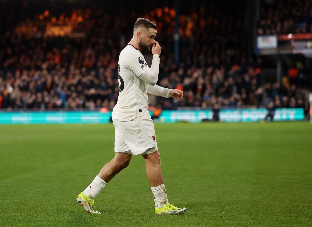 Manchester United's Luke Shaw walks off the pitch to be substituted due to injury. — Reuters pic