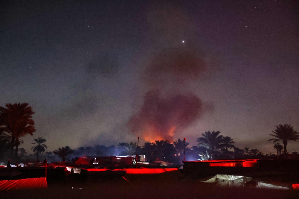 Smoke rises during an Israeli strike near a makeshift camp for displaced Palestinians, in Mawasi Khan Yunis in the southern Gaza Strip on December 4, 2024, amid the ongoing war between Israel and the Hamas group. — AFP pic