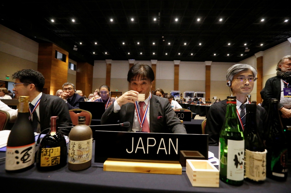 Japan’s Ambassador to Unesco Takehiro Kano drinks sake at the 19th World Cultural Heritage Conference, as Japan’s Sake was added to Unesco’s Intangible Cultural Heritage list, in Asuncion, Paraguay December 4, 2024. — Reuters pic