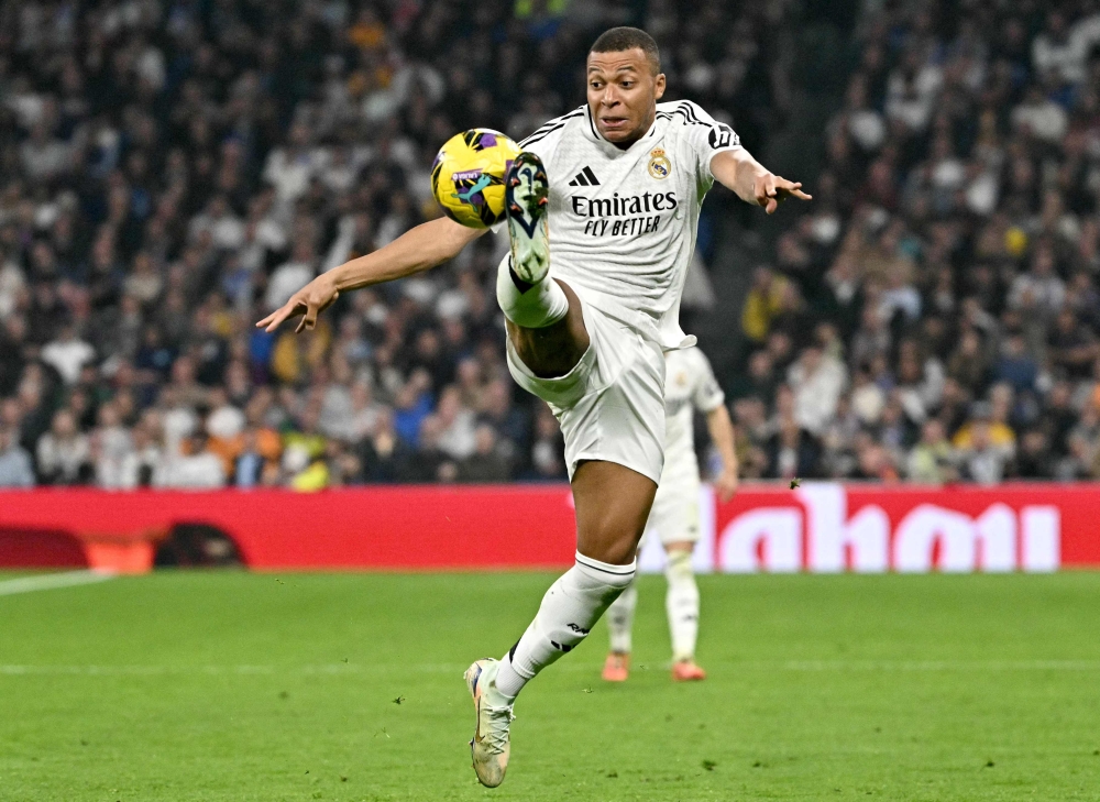 Real Madrid's French forward #09 Kylian Mbappe controls the ball during the Spanish league football match between Real Madrid CF and Getafe CF at the Santiago Bernabeu stadium in Madrid December 1, 2024. — AFP pic