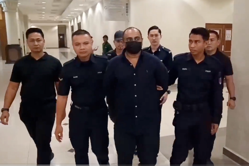 Abd Zackery Ghouse Abd Gafoor, 46 (centre) pleaded not guilty to injuring wife Zahnita Wilson. — Screenshot from X/Bernama