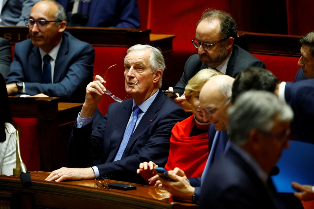 French Prime Minister Michel Barnier reacts during the result of the vote on the first motion of no-confidence against the French government, tabled by the alliance of left-wing parties the ‘Nouveau Front Populaire’ (New Popular Front-NFP), after the use by French government of the article 49.3, a special clause in the French Constitution, to push the budget bill through the National Assembly without a vote by lawmakers, at the National Assembly in Paris, France, December 4, 2024. — Reuters pic 