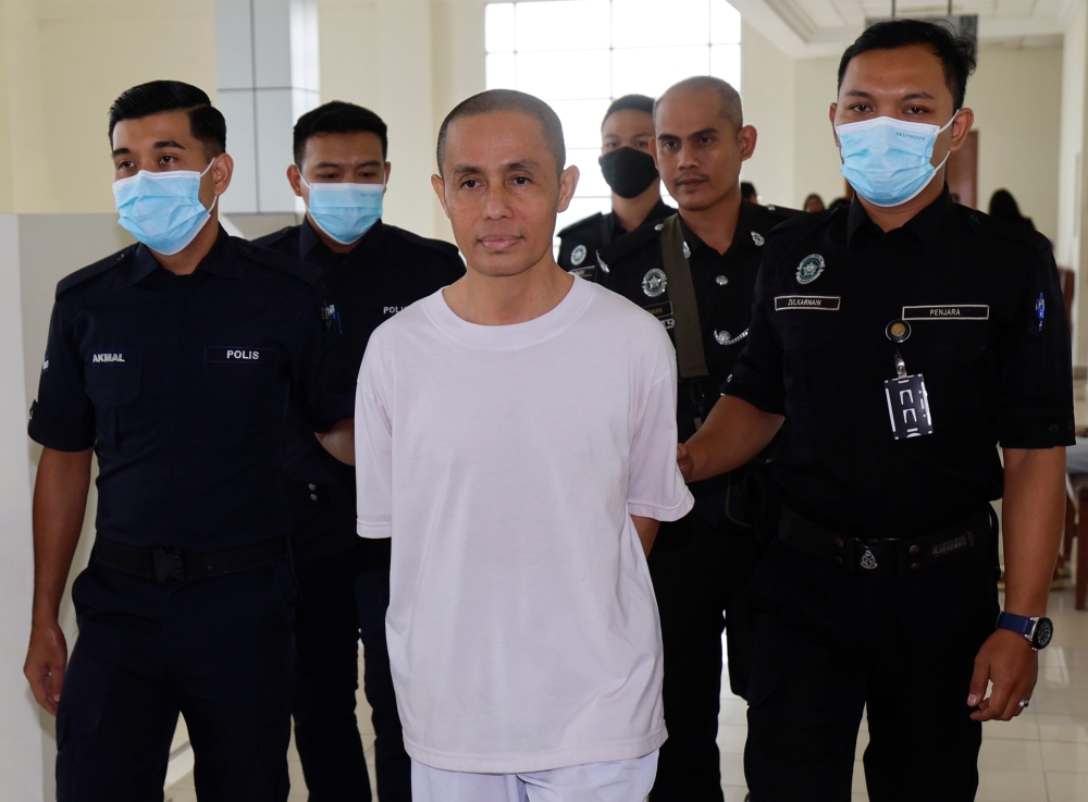 Azman Syah Alias, (centre, in white) who became famous as a finalist on reality TV show ‘Pencetus Ummah’, was convicted of gross indecency against a teenaged boy in Klang and given a 14-month jail sentence out of a maximum 24-months on December 6, 2024. — Bernama pic
