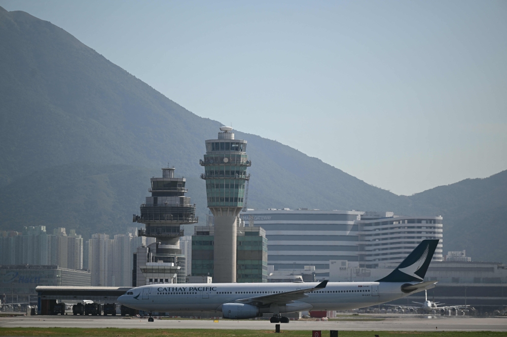 Hong Kong authorities have tightened health screening measures at the airport for all flights arriving from African transit hubs.  — AFP pic