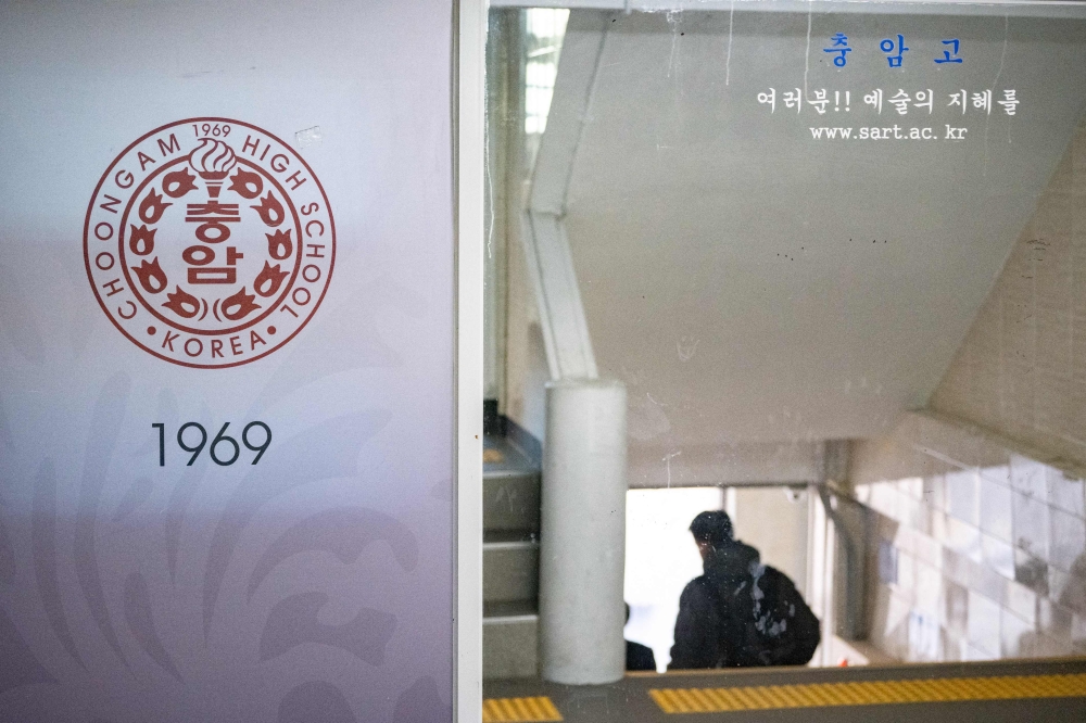 A logo of Choongam High School is pictured inside the campus in Seoul on December 6, 2024. — AFP pic