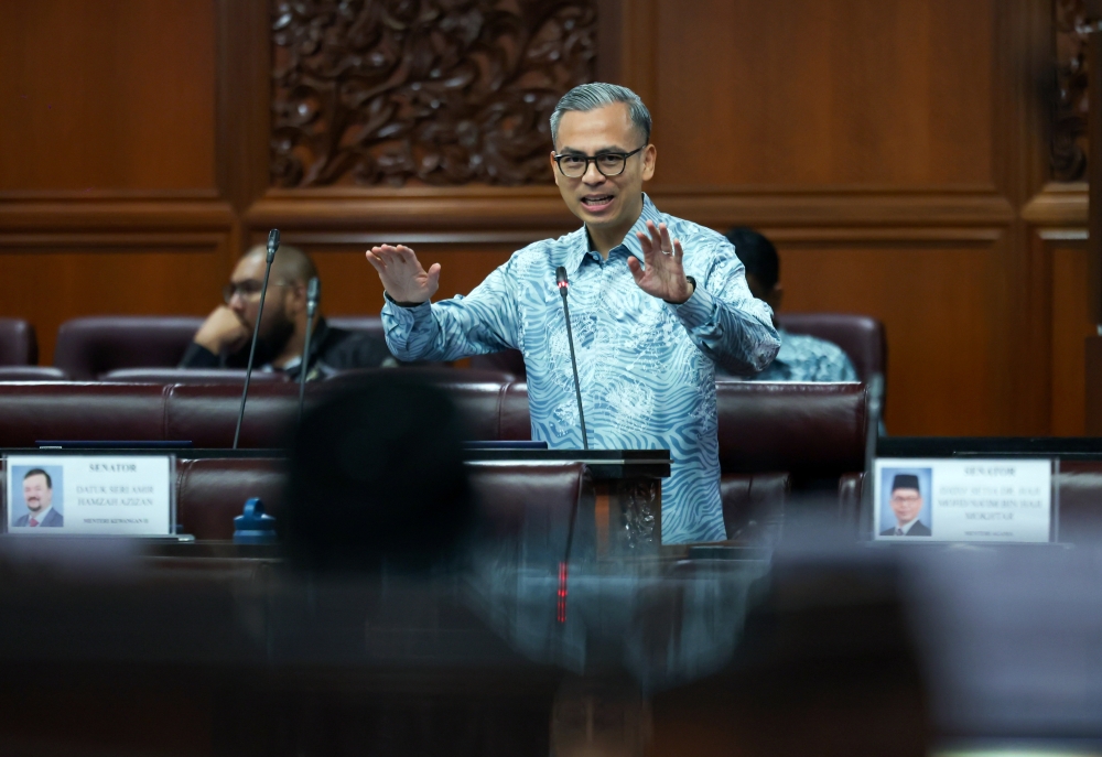 A file photograph shows Communications Minister Fahmi Fadzil speaking in Dewan Rakyat on Dec 5, 2024. — Bernama pic