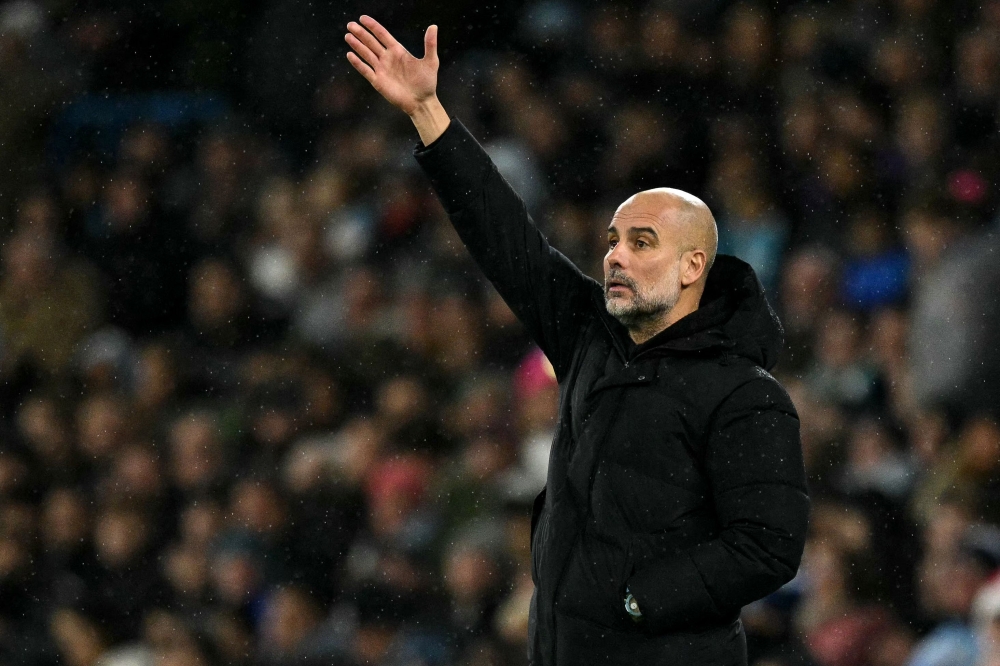 Manchester City's Spanish manager Pep Guardiola reacts on the touchline during the English Premier League football match between Manchester City and Nottingham Forest at the Etihad Stadium in Manchester December 4, 2024. — AFP pic