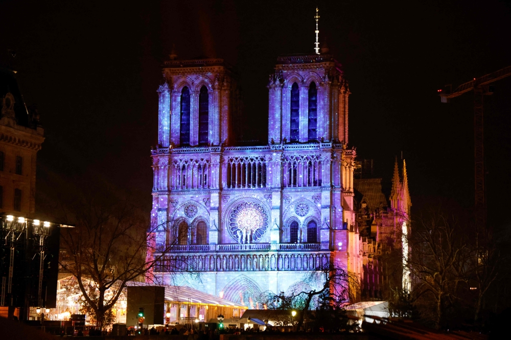 This photograph shows Notre-Dame de Paris cathedral illuminated on the eve of its official reopening, after more than five-years of reconstruction work following the April 2019 fire, in Paris December 6, 2024. — AFP pic