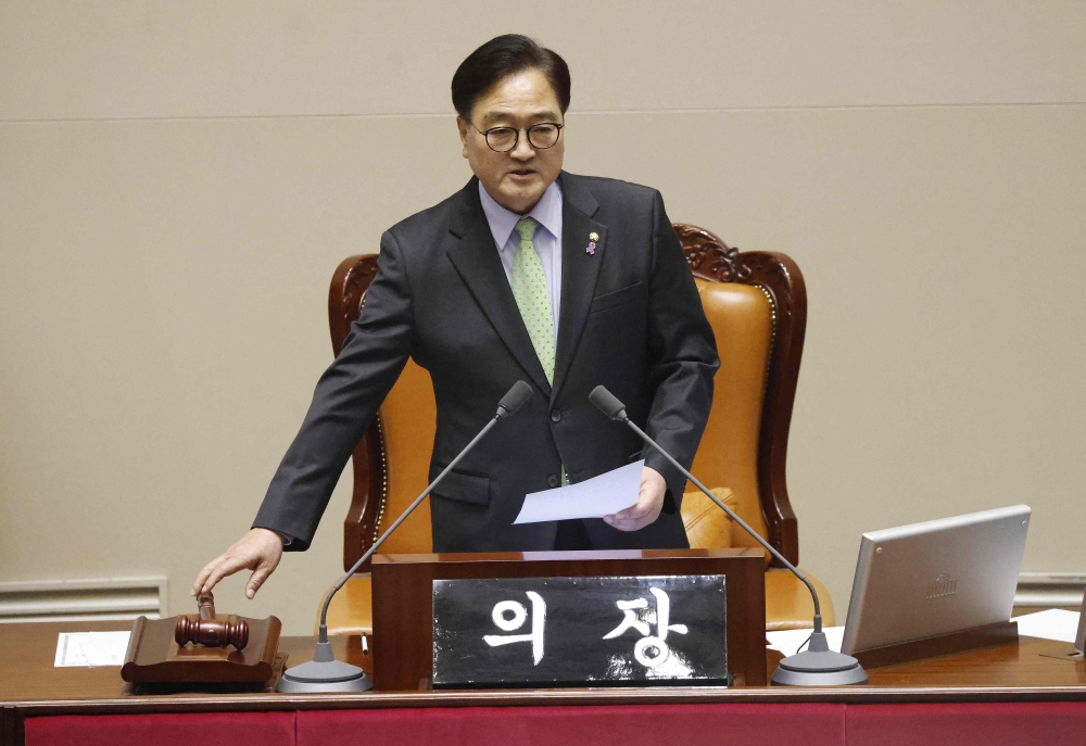 South Korean National Assembly Speaker Woo Won-shik announces that the special legislative bill concerning the first lady has not passed during a plenary session of the impeachment vote of President Yoon Suk Yeol at the National Assembly in Seoul December 7, 2024. — Jeon Heon-kyun/Pool/AFP pic