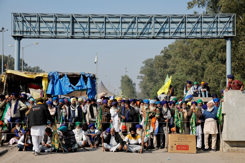 Farmers gather on the day they march towards New Delhi to press for better crop prices promised to them in 2021, at the Shambhu barrier, a border crossing between Punjab and Haryana states, India, December 6, 2024. — Reuters pic