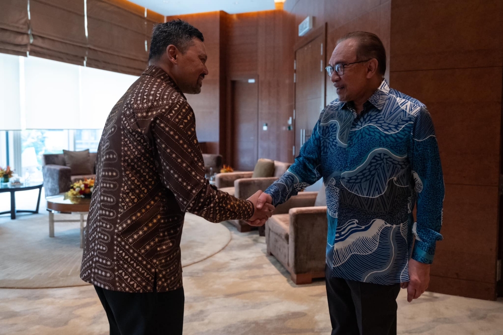 Prime Minister Datuk Seri Anwar Ibrahim greets Brunei Crown Prince Pengiran Muda Mahkota Al-Muhtadee Billah Sultan Hassanal Bolkiah in Putrajaya, on Dec 8, 2024. — Picture from Facebook/Anwar Ibrahim