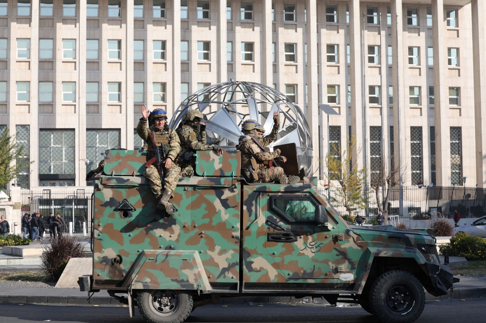 Rebel fights in front of Syrian Central Bank. — Reuters pic