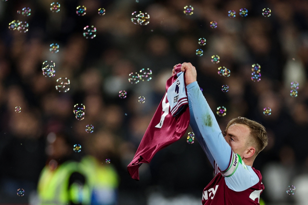 West Ham's Jarrod Bowen holds up Michail Antonio's shirt after scoring against Wolves, paying tribute following Antonio's surgery for a lower limb fracture sustained in a car accident on December 7. — AFP pic 